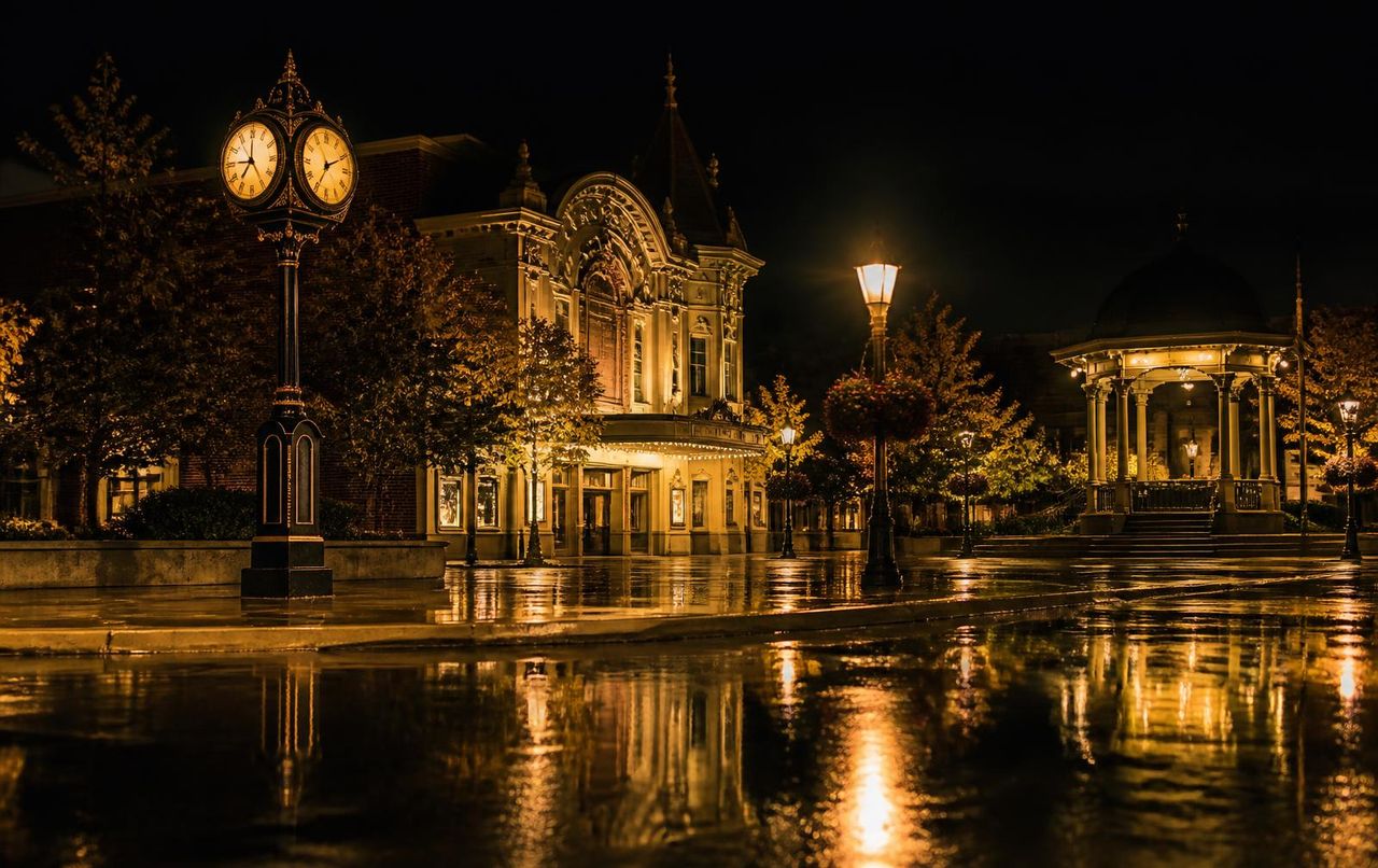 Downtown Brampton Rose Theatre and Garden Square at night after rain
