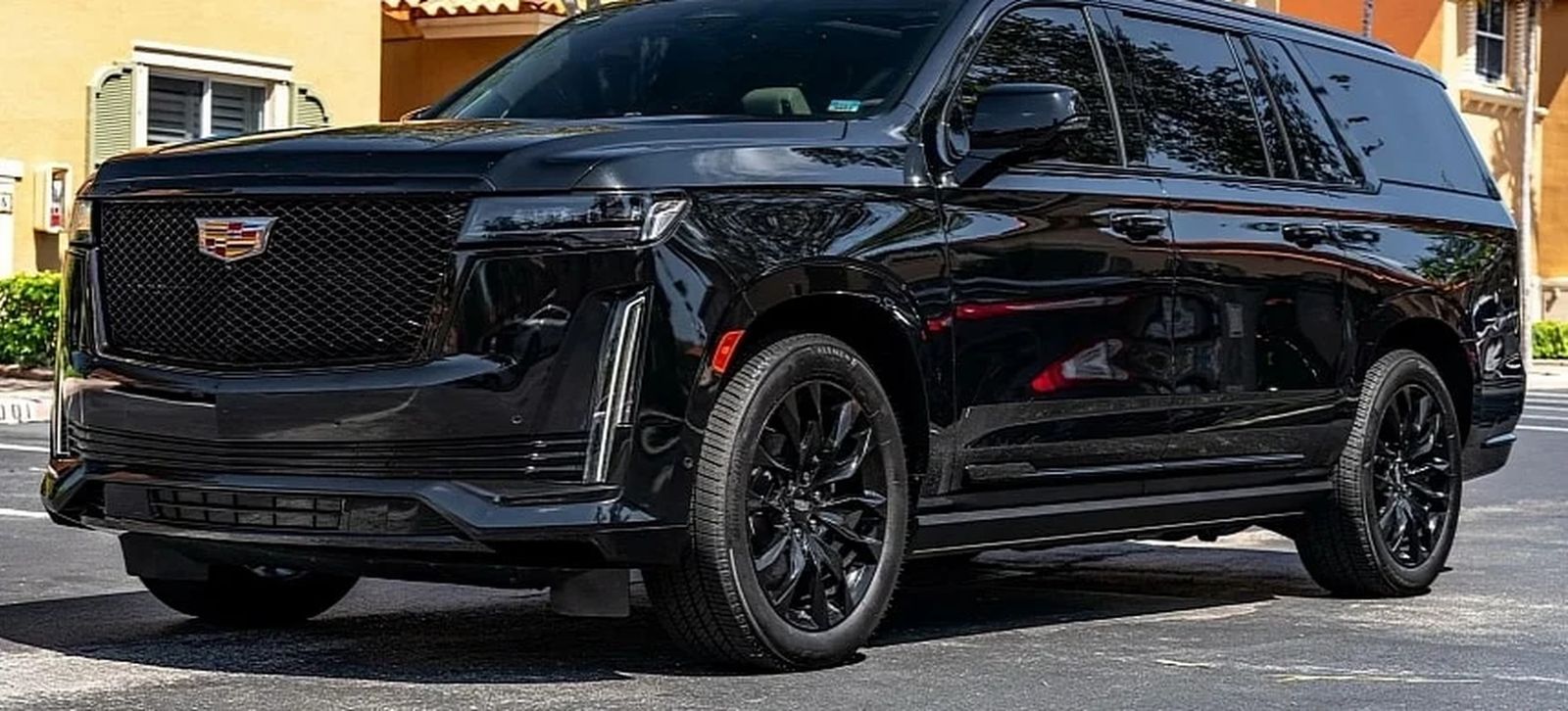 Jet black Cadillac Escalade ESV executive SUV presented for chauffeured service in Toronto