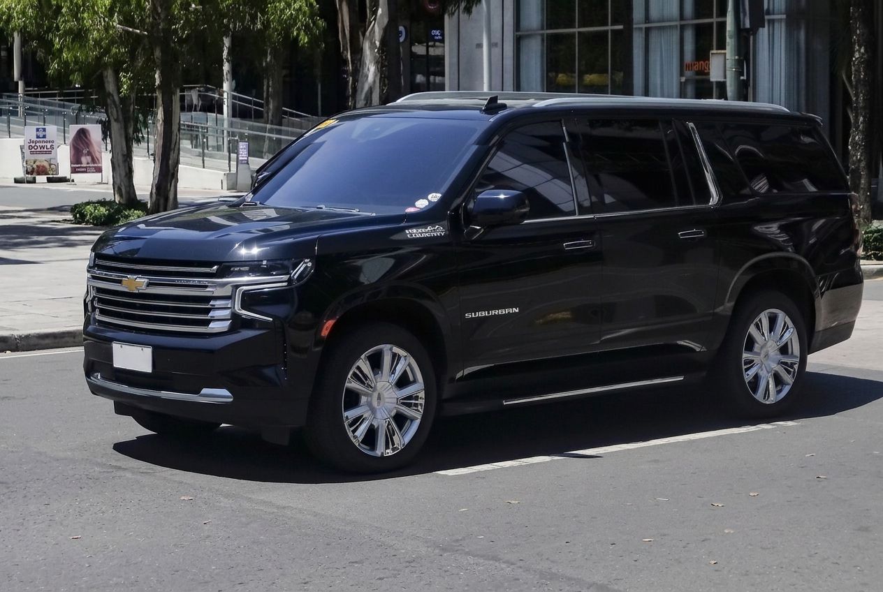 Black Chevrolet Suburban High Country parked on a downtown street